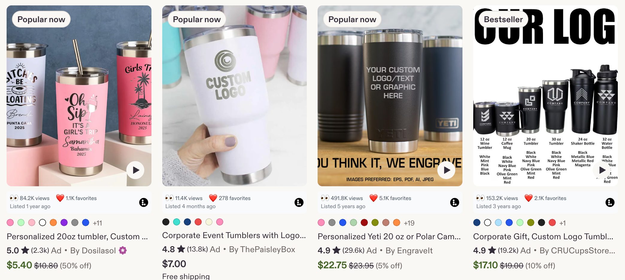 A row of Etsy tumbler listings with the Listadum browser extension showing views and favorites on each card.